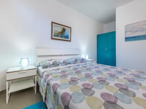 a bedroom with a large bed and a nightstand and a bed sidx sidx sidx at Sardinia SPA Apartment in Geremèas +60 photos