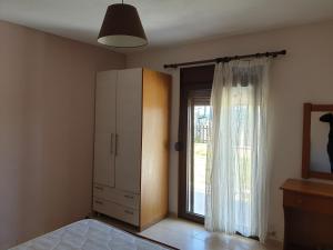 Ένα ή περισσότερα κρεβάτια σε δωμάτιο στο Halkidiki Holy East House