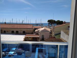 a view of a city from a balcony of a building at B&B Vista Mare in Crotone