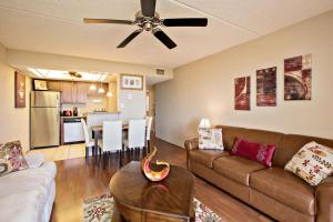 a living room with a couch and a table at Ocean Watch Condo Unit #105 in Ormond Beach
