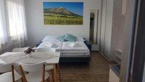 A bed or beds in a room at Apartmány Pemag Mikulov