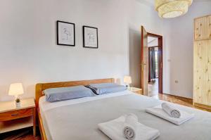 Postel nebo postele na pokoji v ubytování Apartment Adriana