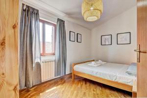 Postel nebo postele na pokoji v ubytování Apartment Adriana