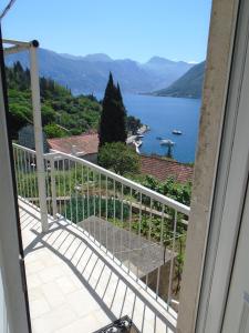 a balcony with a view of a lake at Apartments Jovanović in Perast