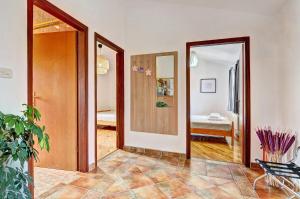 Postel nebo postele na pokoji v ubytování Apartment Adriana