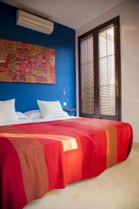 מיטה או מיטות בחדר ב-Rey de Sevilla Flats - Macarena