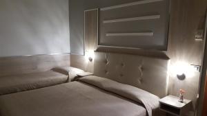 Postel nebo postele na pokoji v ubytování Albergo Paris