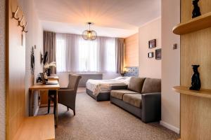 Posteľ alebo postele v izbe v ubytovaní Tailor Hotel Sport & Conference