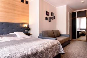Posteľ alebo postele v izbe v ubytovaní Tailor Hotel Sport & Conference