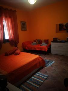 Posteľ alebo postele v izbe v ubytovaní OrangeBalestrate