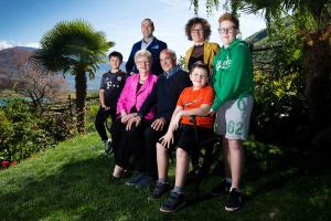 a group of people are posing for a picture at Apartments Seewinkel in Caldaro