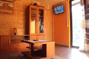 a room with a cabinet and a table in it at Casa do Moinho Novo I in Fontão Fundeiro