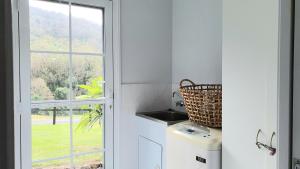 A kitchen or kitchenette at Cadair Cottages