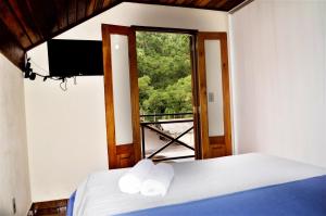Säng eller sängar i ett rum på Casa Luz Serrana