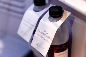 a bottle of wine sitting in a refrigerator at LALA VIANCO BUSINESS Hotel in Busan