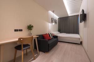 Postel nebo postele na pokoji v ubytování Sleep Box Sukhumvit 22