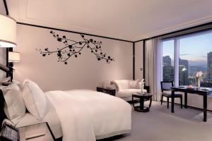 Letto o letti in una camera di The Peninsula Hong Kong