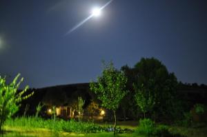 a full moon in the sky at night at Villa Panorama in Moúdhros