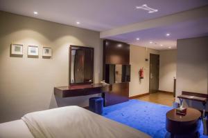 Postel nebo postele na pokoji v ubytování Al Aryam Serviced Apartments