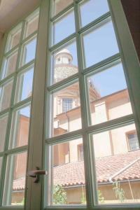 an open window with a view of a building at Hotel Rossetti in Nice