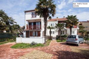 a car parked in front of a house at Marko apartment in Rovinj