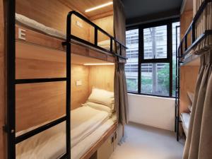 Postel nebo postele na pokoji v ubytování Roomix Shanghai
