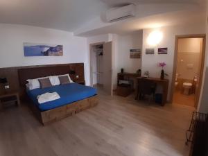 Postel nebo postele na pokoji v ubytování Locanda Sapori