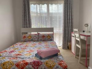 Postel nebo postele na pokoji v ubytování ADA Homestay