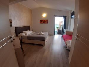 Postel nebo postele na pokoji v ubytování Locanda Sapori