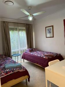 Postel nebo postele na pokoji v ubytování ADA Homestay