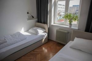 Postel nebo postele na pokoji v ubytování C - Punkt Hostel + 37 fotografií