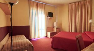 Postel nebo postele na pokoji v ubytování Hotel Atlantic