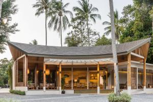 a building with a roof on top of it at NH Collection Samui Peace Resort in Bophut