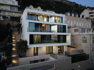 a large white building with many windows at Villa Casa Bianca in Dubrovnik