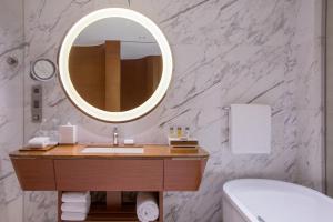 a bathroom with a sink and a mirror at Crowne Plaza Macau, an IHG Hotel in Macau