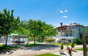 a view of a house with a gazebo and trees at Xenia in Iraklitsa