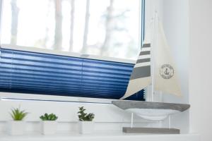 Zdjęcie z galerii obiektu APARTAMENT 19B BLUE MARINE Poddąbie Basen Odkryty Brodziki Plac Zabaw w Poddąbiu