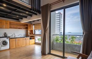 a kitchen with a view of the ocean at Coast House Boutique Hotel in Nha Trang