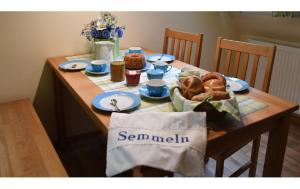 a wooden table with food on top of it at Ferienbauernhof Schuler in Gunzenhausen +61 photos
