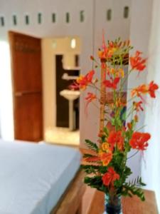 Postel nebo postele na pokoji v ubytování Dragonfly Guesthouse M'Pai Bay