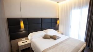 Postel nebo postele na pokoji v ubytování Hotel Principe Palace