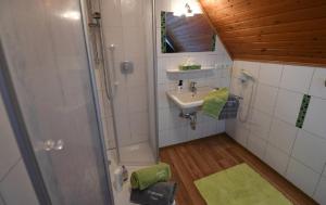 a small bathroom with a sink and a shower at Ferienbauernhof Schuler in Gunzenhausen