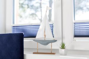 Zdjęcie z galerii obiektu APARTAMENT 19B BLUE MARINE Poddąbie Basen Odkryty Brodziki Plac Zabaw w Poddąbiu