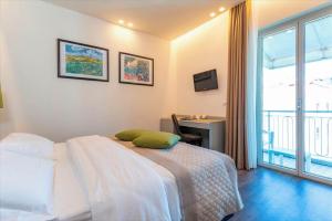 Postel nebo postele na pokoji v ubytování Hotel Principe Palace