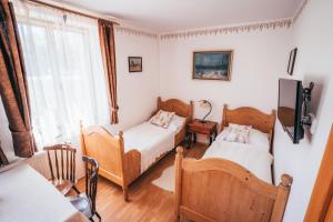 Postel nebo postele na pokoji v ubytování Pension Fialka