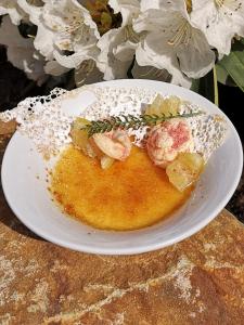 a plate of food with shrimp on a table at Hotel McLimon in Nový Jičín
