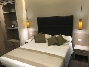 Postel nebo postele na pokoji v ubytování Hotel Principe Palace