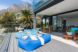 two beds on the deck of a house at Living Hotel Lion's Eye in Cape Town