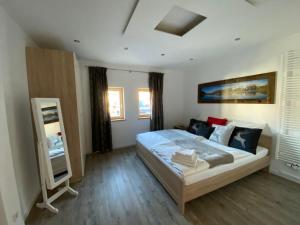 Ένα ή περισσότερα κρεβάτια σε δωμάτιο στο Residence Cosy
