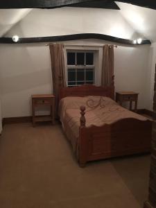 Tempat tidur dalam kamar di The Old Rose And Crown - St Neots